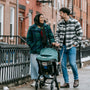 couple with baby stroller